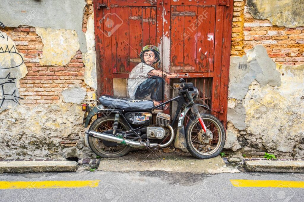 boy on a motorbike, Murales Georgetown